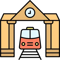 Ein Bahnhof mit einem roten Zug, der unter einem großen Tor mit einer Uhr fährt. Die Architektur ist einfach und klar gestaltet.