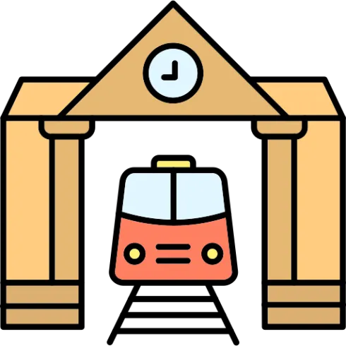 Ein Bahnhof mit einem roten Zug, der unter einem großen Tor mit einer Uhr fährt. Die Architektur ist einfach und klar gestaltet.